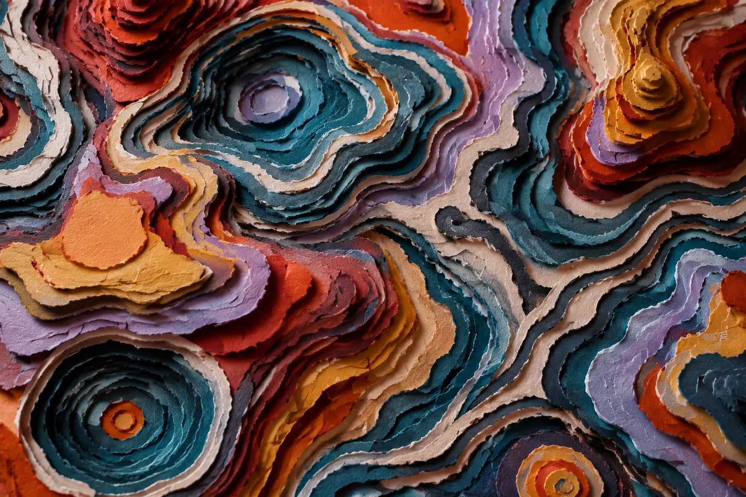 Hand-torn paper relief with irregular contours in petrol, brick red, saffron, lilac and ivory